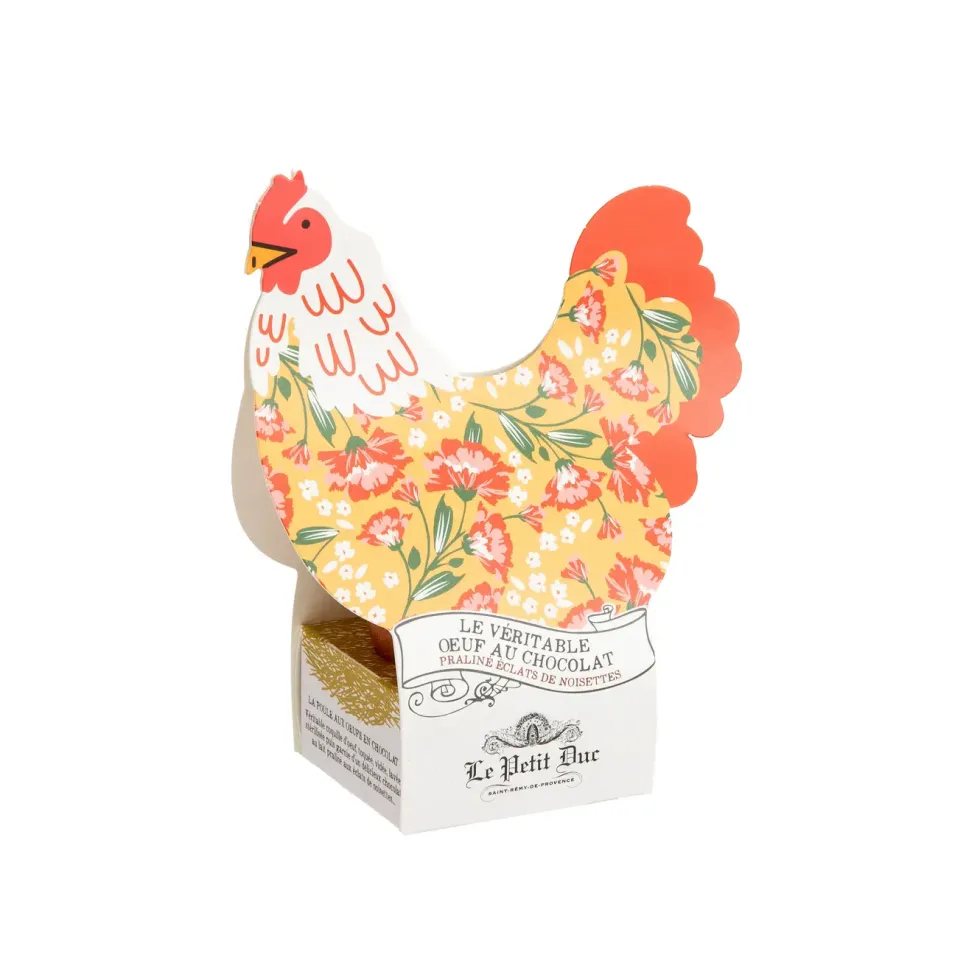 Véritable œuf coquille au chocolat praliné avec éclats de noisettes dans étui forme poule Le Petit Duc - 50 g